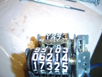  decide to relieve the pinching by adjusting the other end of the cup/spindle/pointer assembly by slackening that tiny screw in the centre allowing more endfloat